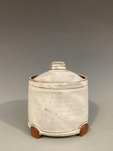 White thrown and altered jar by Karen Fevold